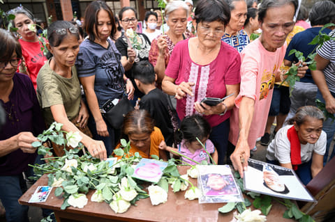 Families of victims of former Philippines president Rodrigo Duterte's "war on drugs" take part in a thanksgiving mass at a church in Manila on March 31, 2025, weeks after Duterte was arrested and brought to the International Criminal Court (ICC) in The Hague.