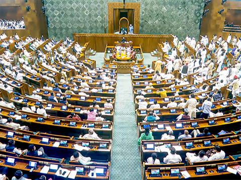 Opposition MPs protest in the Lok Sabha against the Waqf (Amendment) Bill during the Budget Session of Parliament, in New Delhi on Wednesday, April 2, 2025.