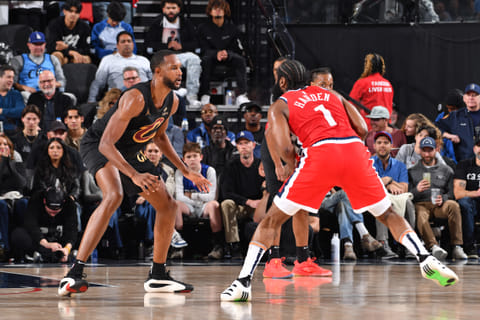 Evan Mobley of the Cleveland Cavaliers plays defense against James Harden of the LA Clippers