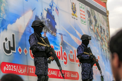 Members of Huthi-affiliated security forces stand guard during a rally in solidarity with Palestinians in the Gaza Strip and in condemnation of US strikes, in Yemen's Huthi-controlled capital Sanaa on April 11, 2025.
