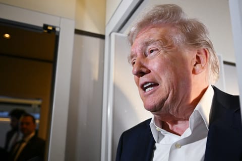 US President Donald Trump speaks to reporters while in flight on Air Force One, en route fo Palm Beach International Airport in West Palm Beach, Florida, on April 11, 2025.