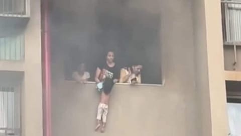 Firefighters rescue woman and child from high-rise fire in Ahmedabad