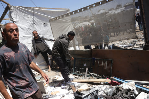 Palestinians inspect the damage after an Israeli strike on a school housing displaced Palestinians in Jabalia in the northern Gaza Strip on April 17, 2025.