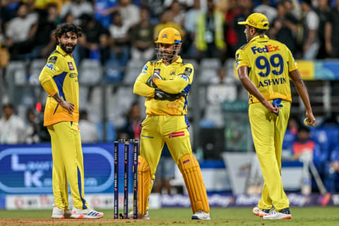 Chennai Super Kings' Ravindra Jadeja (left), Ravichandran Ashwin (right) and captain MS Dhoni discuss during the match against Mumbai Indians at the Wankhede Stadium.
