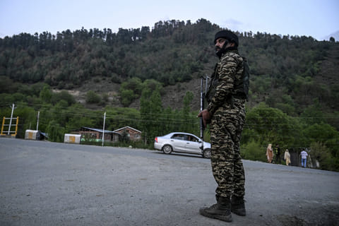 An Indian paramilitary personnel stands guard near Pahalgam, south of Srinagar, on April 22, 2025, following an attack.