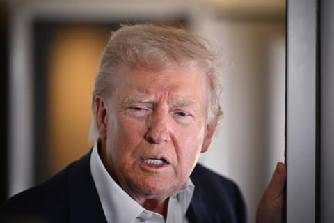 US President Donald Trump speaks to reporters while in flight on Air Force One, en route to Rome, Italy on April 25, 2025.