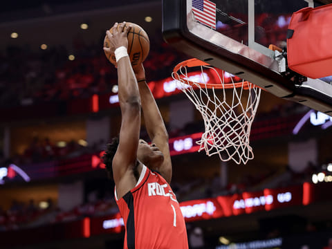 Amen Thompson of the Houston Rockets dunks the ball against the Golden State Warriors during the second quarter in Game Five of the Western Conference First Round NBA Playoffs.