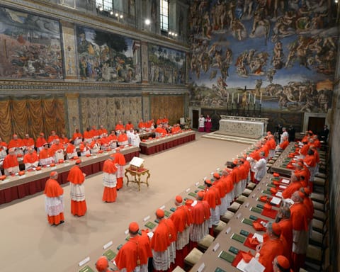 A handout picture released by the Vatican Press office shows cardinals queuing in the Sistine Chapel before the start of the conclave at the Vatican on March 12, 2013.