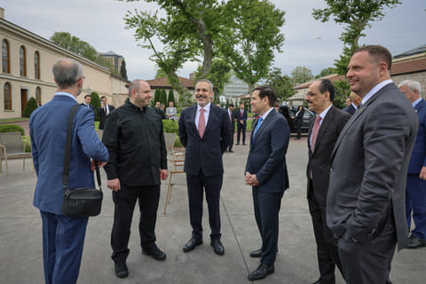 This handout photograph taken and released by Turkish Foreign Ministry on May 16, 2025, shows Turkey's Foreign Minister Hakan Fidan (3rd L), US Secretary of State Marco Rubio (4th L), Ukraine's Head of the Office of the President Andriy Yermak (R), Ukraine's Defence Minister Rustem Umerov (2nd L) and Turkish Intelligence Organization Director Ibrahim Kalin (2nd R) chatting at the backyard of the Turkish Presidential office Dolmabahce, in Istanbul, ahead their meeting for Ukraine-Russia peace talks.