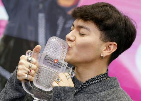 Austrian singer Johannes Pietsch aka JJ, winner of the 2025 Eurovision Song Contest, poses with the trophy during a press conference in Vienna, Austria on May 18, 2025.