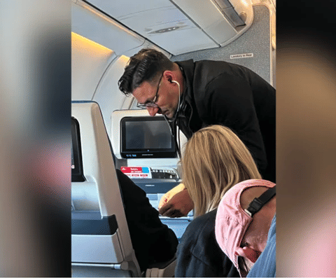Cardiologist Dr. TJ Trad calmly helps a fellow passenger who had a suspected heart attack on a KLM flight.