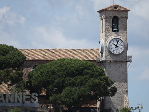 A clock remains stuck at a few minnutes past 10:00 am, the time at which a widescale power outage struck Southwestern France, on a clocktower in Canne's old district "Le Suquet", on the final day of the 78th edition of the Cannes Film Festival in Cannes.