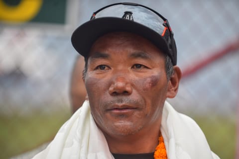 Nepali guide Kami Rita Sherpa looks on after his arrival at the Tribhuvan airport in Kathmandu on May 25, 2023.