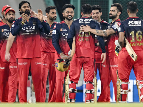 Royal Challengers Bengaluru's captain Jitesh Sharma (4R) is congratulated by teamates for his innings as they celebrate their team's win against Lucknow Super Giants at the end of their IPL match in the Ekana Cricket Stadium of Lucknow on May 27, 2025.