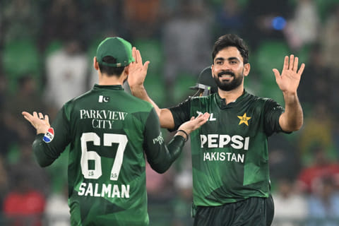 Pakistan's Khushdil Shah (R) celebrates with Salman Ali Agha (L) after taking the wicket of Bangladesh's Towhid Hridoy (not pictured) during the first Twenty20 international cricket match between Pakistan and Bangladesh at the Gaddafi Cricket Stadium in Lahore on May 28, 2025.