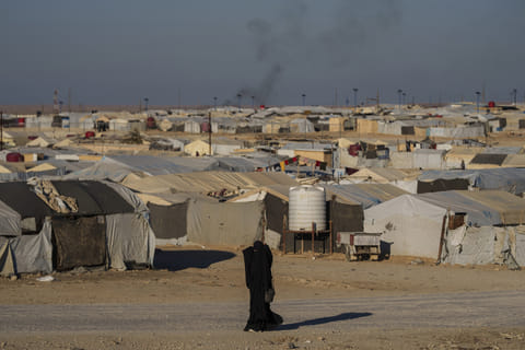 A woman walks in the al-Hol camp in northeastern Syria's Hasakeh province, where tens of thousands of mostly women and children linked to the Islamic State group have been living for years. File photo taken on Thursday, Jan. 30, 2025.