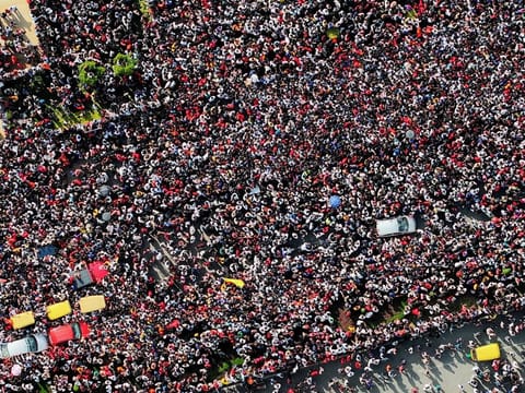 A massive crowd gathered for the Royal Challengers' victory celebrations near Vidhana Souda in Bengaluru on Wednesday.