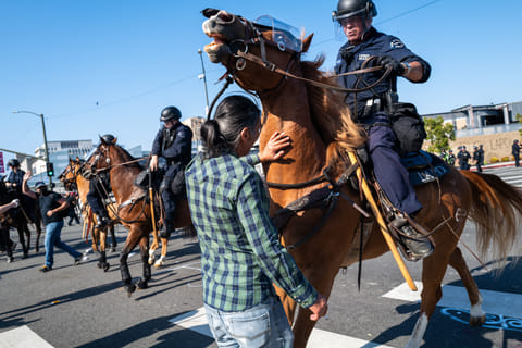 The National Guard, police and protesters clash following two days of protests after a series of immigration raids on June 08, 2025 in Los Angeles, California.
