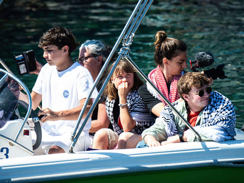 Climate activist Greta Thunberg, center, waits to board the Madleen boat, before setting sail for Gaza along with activists of the Freedom Flotilla Coalition, departing from the Sicilian port of Catania, Italy, Sunday, June 1, 2025.