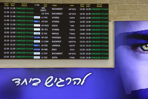 A board showing cancelled flights stands at arrivals hall at Ben Gurion Airport near Tel Aviv on June 13, 2025 after Israel closed its air space to takeoff and landing.
