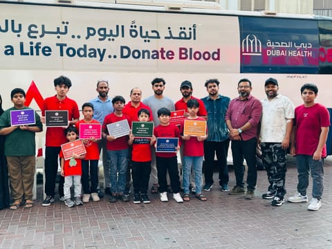 Members of the Kindness Blood Donation Team with young ambassadors of blood donation at a mobile blood donation drive held in Dubai on Friday.