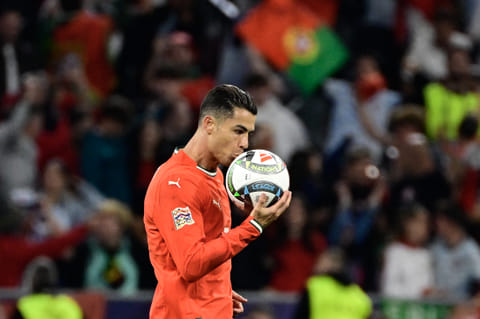 Portugal's forward Cristiano Ronaldo kisses the ball after scoring the 2-2 equaliser during the Uefa Nations League final football match against Spain in Munich, southern Germany on June 8, 2025.