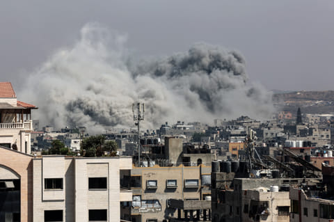 A plume of smoke billows in Jabalia in the northern Gaza Strip during an Israel strike on June 19, 2025.