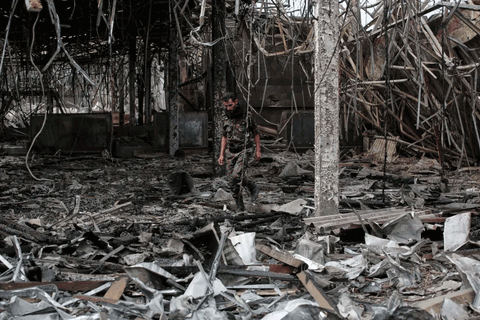 A Yemeni officer inspects the damage following Israeli airstrikes on Sanaa International Airport on May 7, 2025
