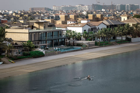 A picture shows beachfront villas in the Palm Jumeirah in the Gulf emirate of Dubai on July 8, 2025.