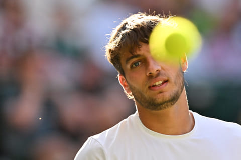 Italy's Flavio Cobolli eyes the ball as he plays against Serbia's Novak Djokovic during their men's singles quarter-finals in London on Wednesday.