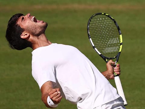 Spain's Carlos Alcaraz celebrates after winning against US player Taylor Fritz during their men's singles semi-final tennis match of the 2025 Wimbledon Championships at The All England Lawn Tennis and Croquet Club in Wimbledon, southwest London, on July 11, 2025.