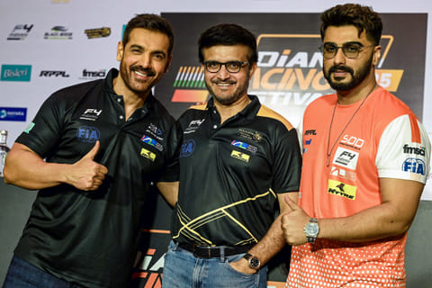 India's former cricket captain Sourav Ganguly (C) with actors John Abraham (L) and Arjun Kapoor