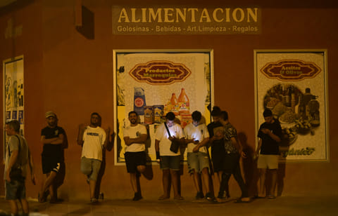 Youngsters stand in San Antonio district in Torre Pacheco, southeastern Spain, on July 15, 2025 as a rally has been called by far-right groups following four days of anti-migrant unrest.