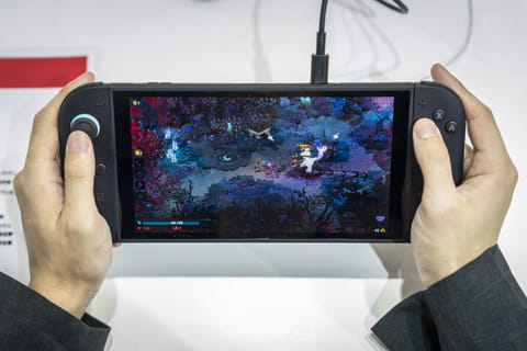 A vistor plays 'Hades 2' an upcoming independent game for Nintendo's Switch 2 during the BitSummit indie gaming expo in Kyoto city, Kyoto prefecture on July 18, 2025.