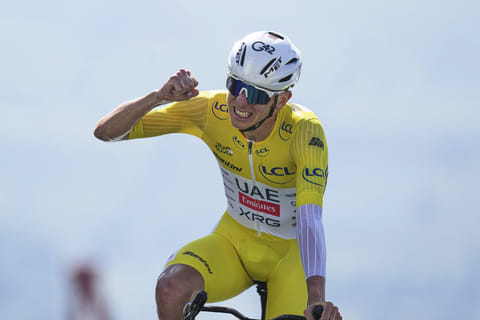 Slovenia's Tadej Pogacar, wearing the overall leader's yellow jersey, celebrates after winning the 13th stage of the Tour de France, an individual time-trial over 10.5 kilometres (6.5 miles) in the Pyrenees mountains on Friday.