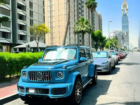 It's a head-turning 4WD monster with a Brabus kit, wrapped in a rare bluish finish and bold orange leather inside.