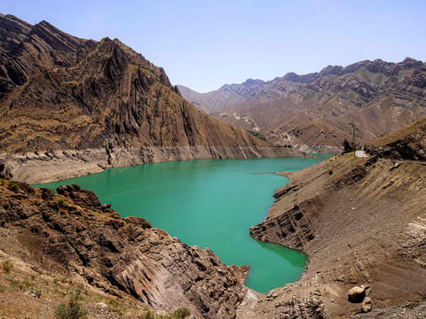 Diminished water levels are pictured in the reservoir behind the Amir Kabir dam along the Karaj river in Iran's northern Alborz mountain range on June 1, 2025.