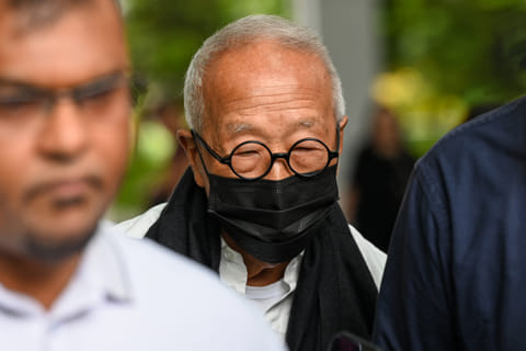 Malaysian hotel tycoon Ong Beng Seng (C) leaves the State Court in Singapore on August 4, 2025.