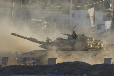 An Israeli tank moves near the border of the Gaza Strip in southern Israel, Wednesday, August 6, 2025.