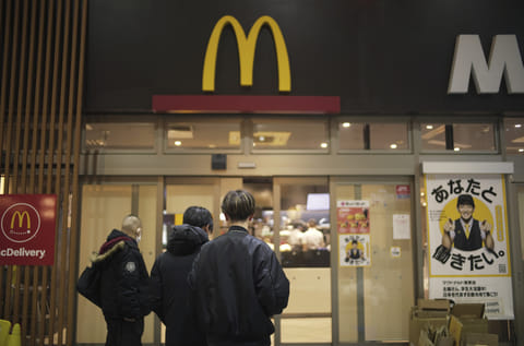 People stand outside a McDonald's store in Tokyo.