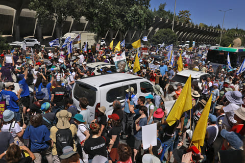 Families and supporters of Israelis held hostage by Hamas militants in Gaza since the October 7, 2023 attacks, during a protest in Jerusalem on August 17, 2025, calling for government action to secure their release.