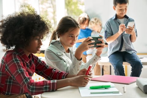 While some parents lean toward a stricter approach, other schools have experimented with solutions that let kids stay connected without creating distractions.
