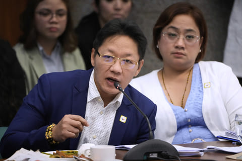 Private contractors Pacifico Discaya. left, and wife Sarah speaks during investigations on flood-control projects at the Senate Blue Ribbon committee in Pasay city, Philippines on Monday, Sept. 8, 2025.