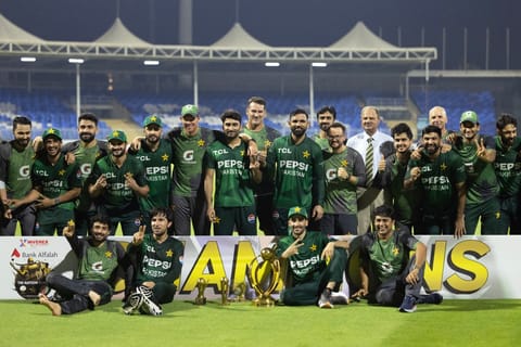 Pakistan's team pose with the trophy after winning the T20 international cricket match against Afghanistan in Sharjah on September 7, 2025.