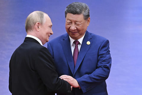 Russian President Vladimir Putin, left, and Chinese President Xi Jinping greet each other in Tianjin, China, on Aug. 31, 2025 in this file picture.