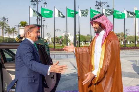 A handout picture provided by the Saudi Press Agency (SPA) on September 17, 2025, shows Saudi Arabia's Crown Prince Mohammed bin Salman (R) welcoming Pakistan's Prime Minister Shehbaz Sharif ahead of their meeting in Riyadh.