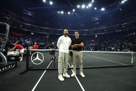 NBA player Steph Curry of the Golden State Warriors talks with former tennis player Roger Federer on court during day two of Laver Cup 2025 at Chase Center on September 20, 2025 in San Francisco, California.