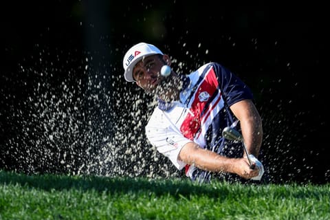 Scottie Scheffler of Team United States plays a shot from a bunker on the second hole during a practice round prior to the Ryder Cup 2025 at Black Course at Bethpage State Park Golf Course on September 22, 2025 in Farmingdale, New York.