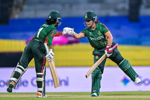 Bangladesh's Rubya Haider (R) and Nigar Sultana bump their fists during the ICC Women's Cricket World Cup 2025 One-Day International match at the R. Premadasa International Cricket Stadium in Colombo on October 2, 2025.