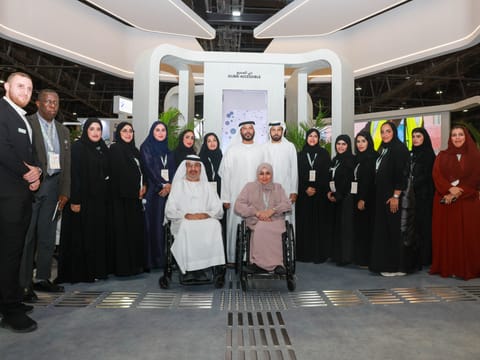 Director General of Dubai Municipality Marwan Bin Ghalita (centre), poses for a group photo at the civic body's stand at AccessAbilities Expo 2025 on Monday.